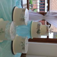 Modern silver leaf wedding cake with bespoke glass flowers 