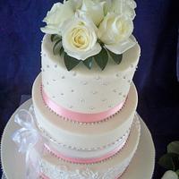 pink and white lace wedding cake