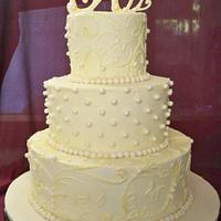 white sparkly buttercream wedding cake with lace piping
