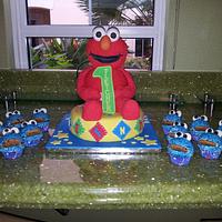 elmo cake with cookie monster cupcakes