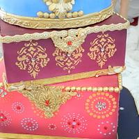 ornate luggage on an elephant stand