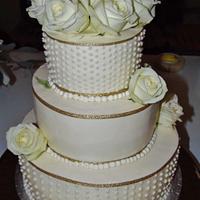 Buttercream gold and dots wedding cake