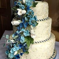 Ivory lace with blue hydrangea, sweet pea, and eucalyptus sugar flowers wedding cake :) x