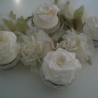 Ivory roses in lace and pearl cases