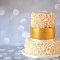 Ruffles and gold wedding cake