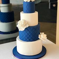 Navy and White Wedding Cake with Sugar Swans and White Roses 