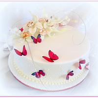 Orchid and butterflies wedding cake