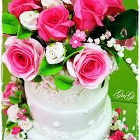 Cake with roses and lilies of the valley