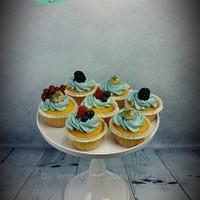 Business cake and cupcakes with fresh fruit