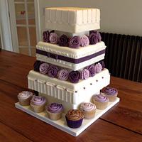 Ivory and purple wedding cake.