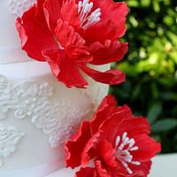 lace and ruby red peony wedding cake 
