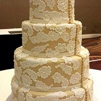 Lace and button wedding cake