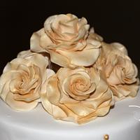 Gold and white wedding cakes