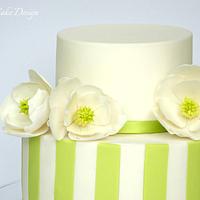sugar magnolia and fondant striped cake