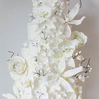 White on white wedding with twigs and orchids