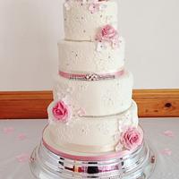 Ivory lace and roses wedding cake