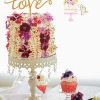 Valentine meringue cake with edible flowers  