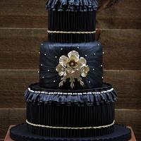 black and gold pleated wedding cake