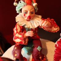 Fondant figure of the little girl and the harlequin