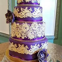 Purple and gold wedding cake 