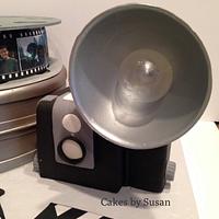 Old camera movie themed grooms cake