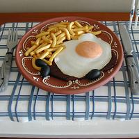 Steak with mounted egg