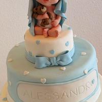 Christening cake with baby and teddy bear