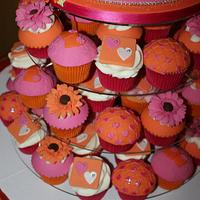 Hot pink topsy turvy wedding cake with hand made sugar gerbera's and hearts