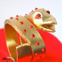 Red and Gold Bracelet Cake