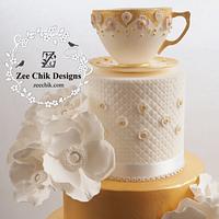 gold cup and saucer primose flowers cake