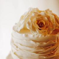 Wedding cake with ruffles and roses