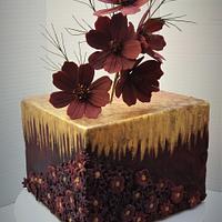 Cake with chocolate cosmos flowers