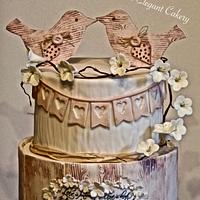 Rustic love bird wedding cake