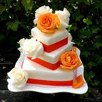 tangerine wedding cake with fresh roses