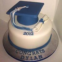 Blue and white graduation cake