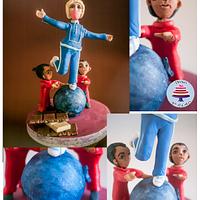 Violet balancing on a Blueberry - 50 Years of Charlie and the Chocolate Factory Collaboration 
