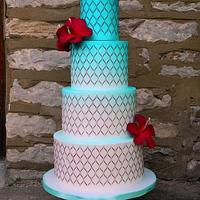 Djerba inspired wedding cake with red hibiscus