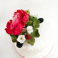Anniversary cake with peony and blackberries