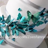 Teal coloured butterfly wedding cake