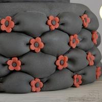 Black billowed cake with red accents