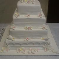 Frangipani and sea shell wedding cake