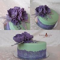 Birthday cake with purple sugar flowers