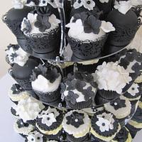 black and white wedding cake and cupcake tower 