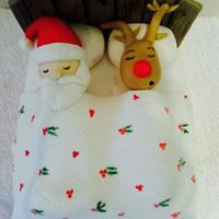 Santa and Rudolf in the bed