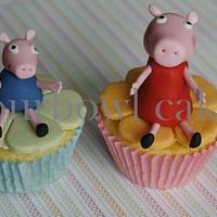 Peppa pig and George playing in a pool of mud and cupcakes