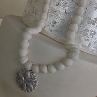 Vintage look with silver leaf and pearls.
