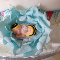 Christening cake with bumble bee baby