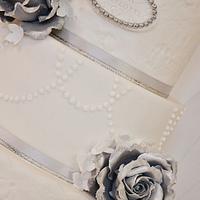 Silver/white wedding cake.
