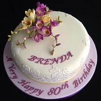 Purple and lemon freesias 80th birthday cake 