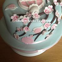 beautiful birdcage and cherry blossom cake